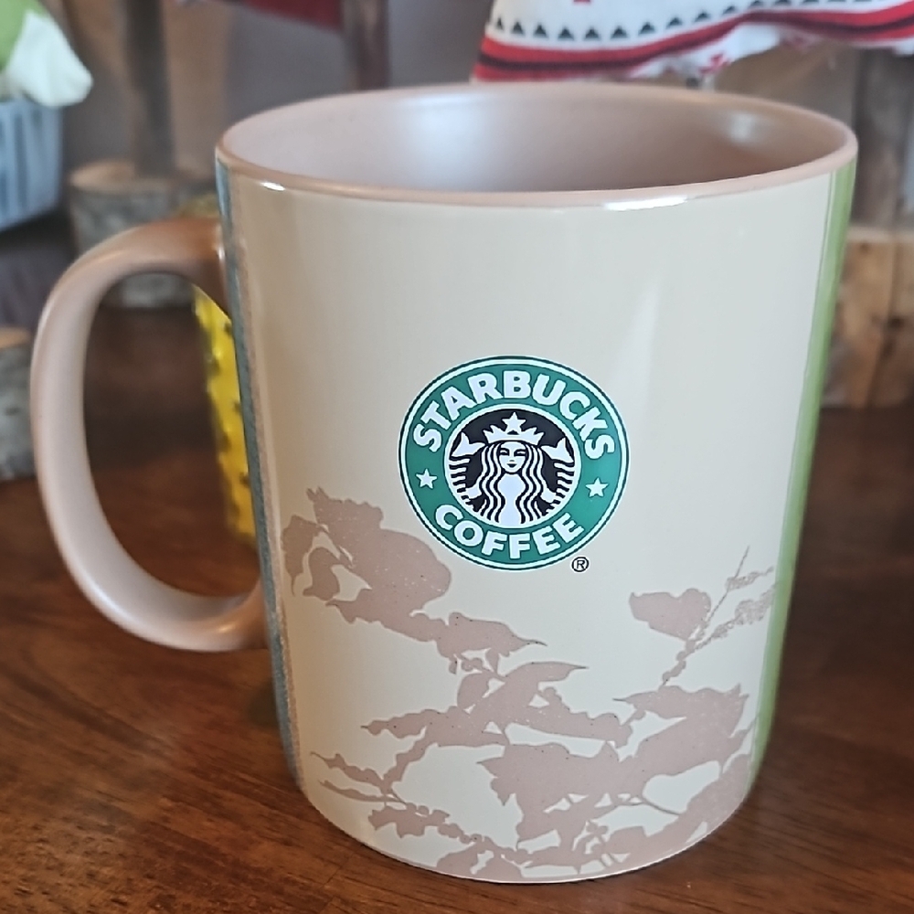 Starbucks Cream Accent Mug with Iconic Logo and Decorative Pattern